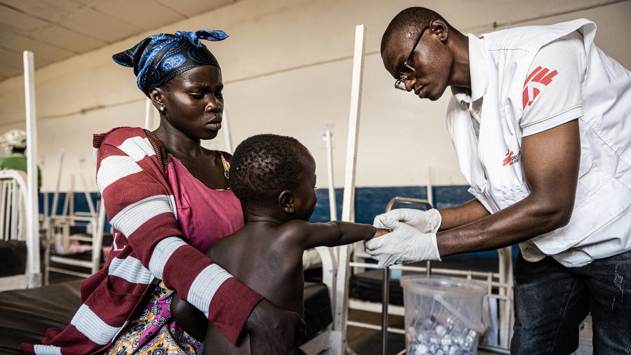 MSF nurse, François Idembe administers an injection to Rutha's son, Bariki with the aim of reducing his high fever and alleviating the infection that is causing discomfort to him. Hospital of Drodro, Ituri province, DRC